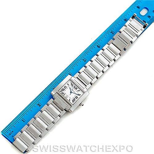 The Cartier Tank Francaise W51002Q3 Men
s Stainless Steel Silver Dial W51002Q3 Men
s Stainless Steel Silver Dial watch is shown flat with its full metal bracelet and a blue ruler measuring its length.