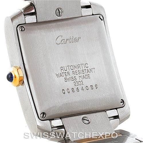 This image shows the back case of a Cartier Tank Francaise W51005Q4 Men's Steel and Gold (two tone) Silver Dial W51005Q4 Men's Steel and Gold (two tone) Silver Dial watch, including the screw-down case back and visible inscription.