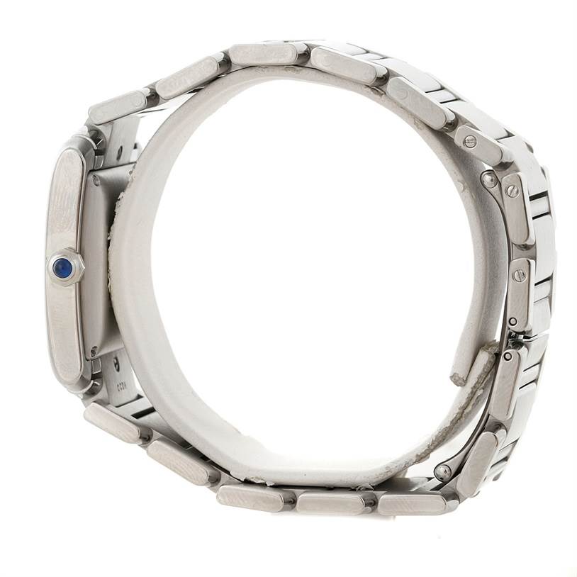 This is a side view of the Cartier Tank Francaise W51002Q3 Men
s Stainless Steel Silver Dial W51002Q3 Men
s Stainless Steel Silver Dial watch, showing the bracelet and case with the blue cabochon crown.