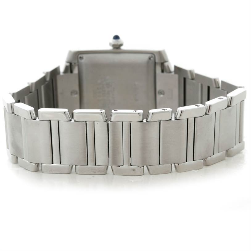 The image shows the back view of the bracelet and case of a Cartier Tank Française watch.