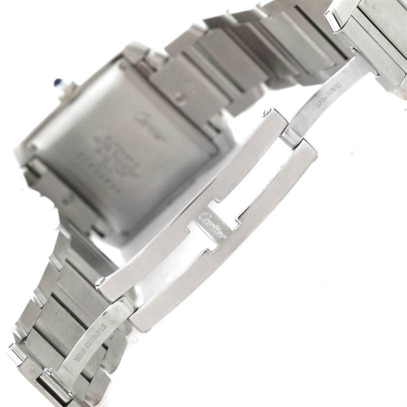 The image shows the back case and bracelet clasp of the Cartier Tank Française watch.
