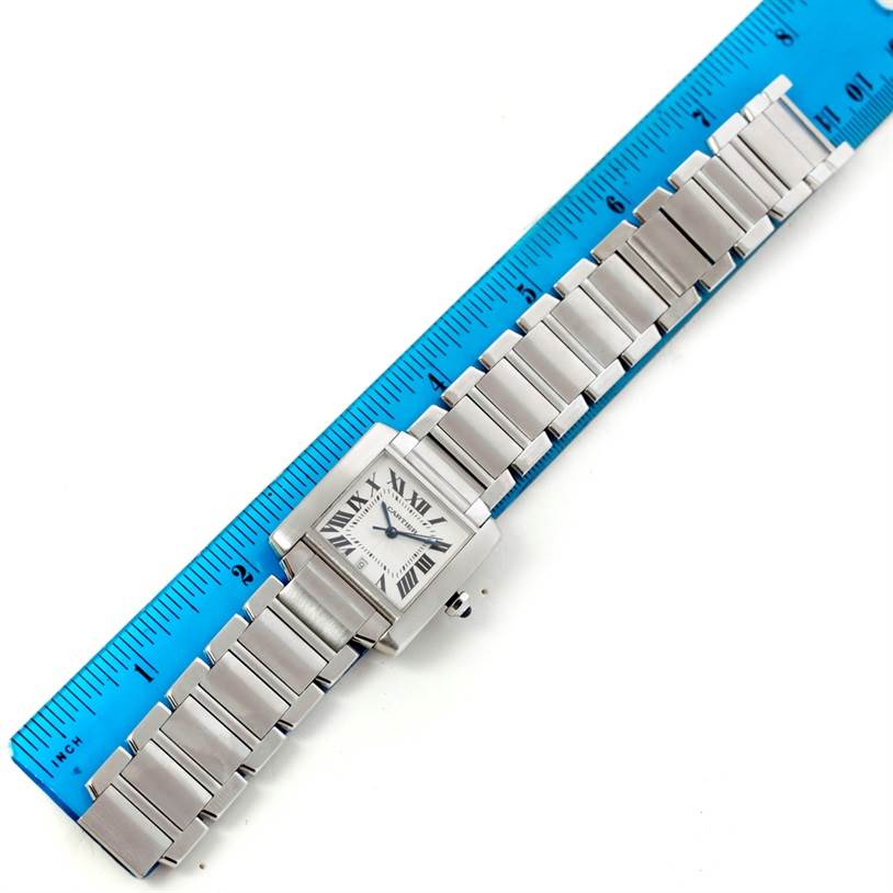 The Cartier Tank Francaise W51002Q3 Stainless Steel Silver Dial W51002Q3 Stainless Steel Silver Dial watch is displayed flat, showcasing its face and stainless steel bracelet alongside a ruler for size reference.