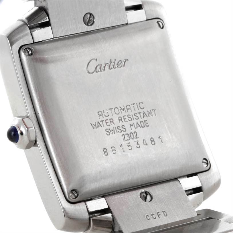 This image shows the back casing and part of the bracelet of a Tank Francaise model by Cartier, highlighting its engraved details.