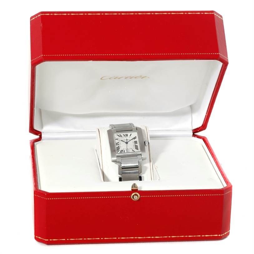 The Cartier Tank Française watch is displayed front view in an open red box with white interior.