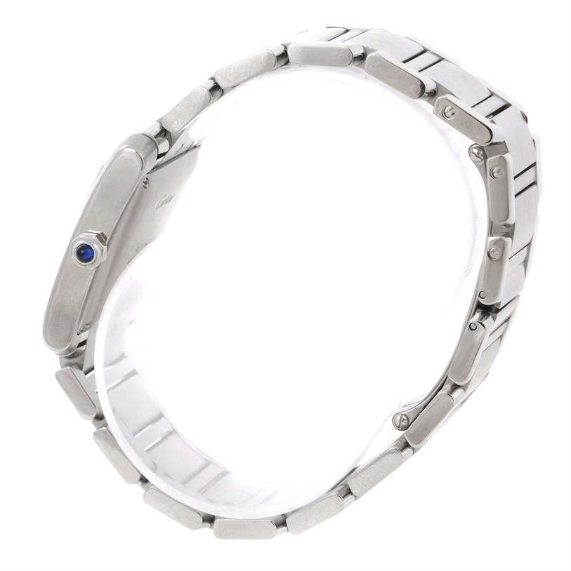 The image shows a side view of a Cartier Tank Francaise W51002Q3 Stainless Steel Silver Dial W51002Q3 Stainless Steel Silver Dial watch, highlighting its silver bracelet and blue cabochon crown.