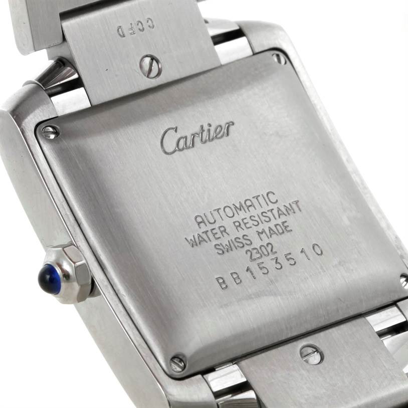 The image shows the back case of a Cartier Tank Francaise W51002Q3 Stainless Steel Silver Dial W51002Q3 Stainless Steel Silver Dial watch, highlighting the brand name, model details, and screws.