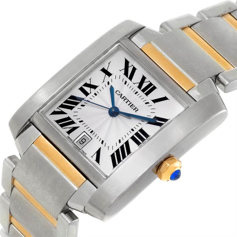 The Cartier Tank Francaise W51005Q4 Men's Steel and Gold (two tone) Silver Dial W51005Q4 Men's Steel and Gold (two tone) Silver Dial watch is shown at a slight angle, highlighting its face, bracelet, dial, and crown with blue cabochon.