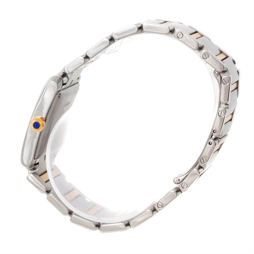 The image shows a side view of the Cartier Tank Francaise W51005Q4 Men's Steel and Gold (two tone) Silver Dial W51005Q4 Men's Steel and Gold (two tone) Silver Dial watch, highlighting its bracelet and crown with a blue cabochon.