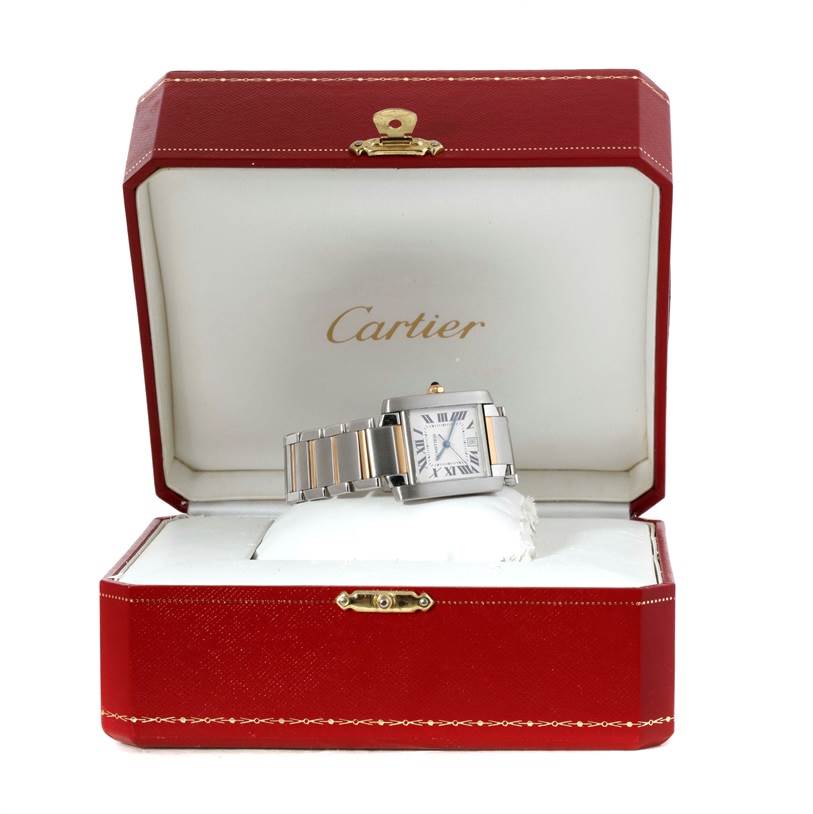 The Cartier Tank Française watch is displayed inside a red Cartier box, showing the face and bracelet.