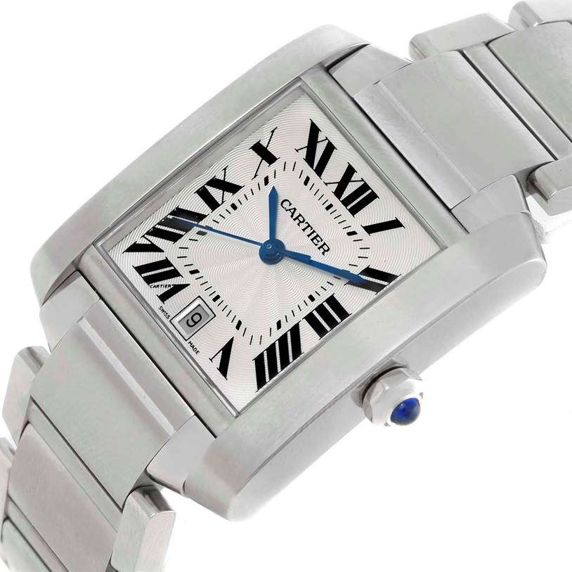 The image shows a Cartier Tank Francaise W51002Q3 Men
s Stainless Steel Silver Dial W51002Q3 Men
s Stainless Steel Silver Dial watch angled to display the face, bracelet, and crown with a blue sapphire cabochon.