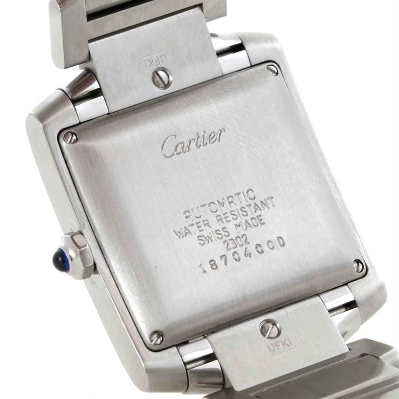 The image shows the back case and part of the clasp of a Cartier Tank Francaise W51002Q3 Men
s Stainless Steel Silver Dial W51002Q3 Men
s Stainless Steel Silver Dial watch, highlighting brand and model details.