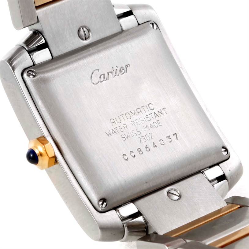 The image shows the back case of a Cartier Tank Française watch, including the clasp and crown.