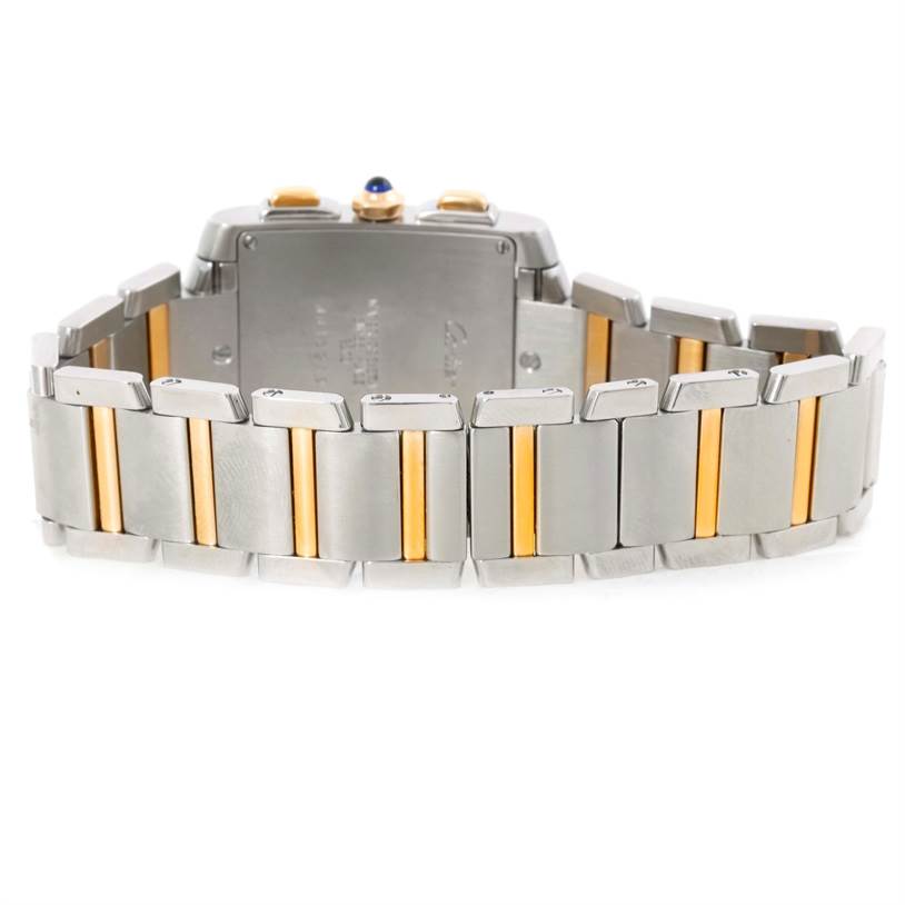 The image shows the back view of the Tank Francaise model by Cartier, highlighting its metal bracelet with gold accents.