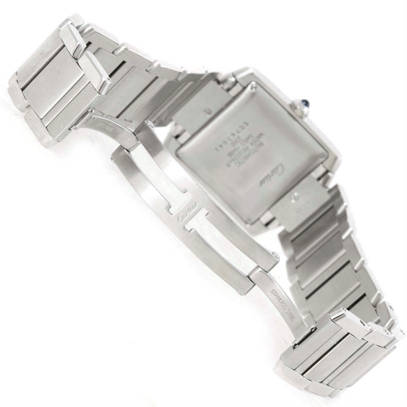 The image shows the back and clasp of a Cartier Tank Française watch with its bracelet.