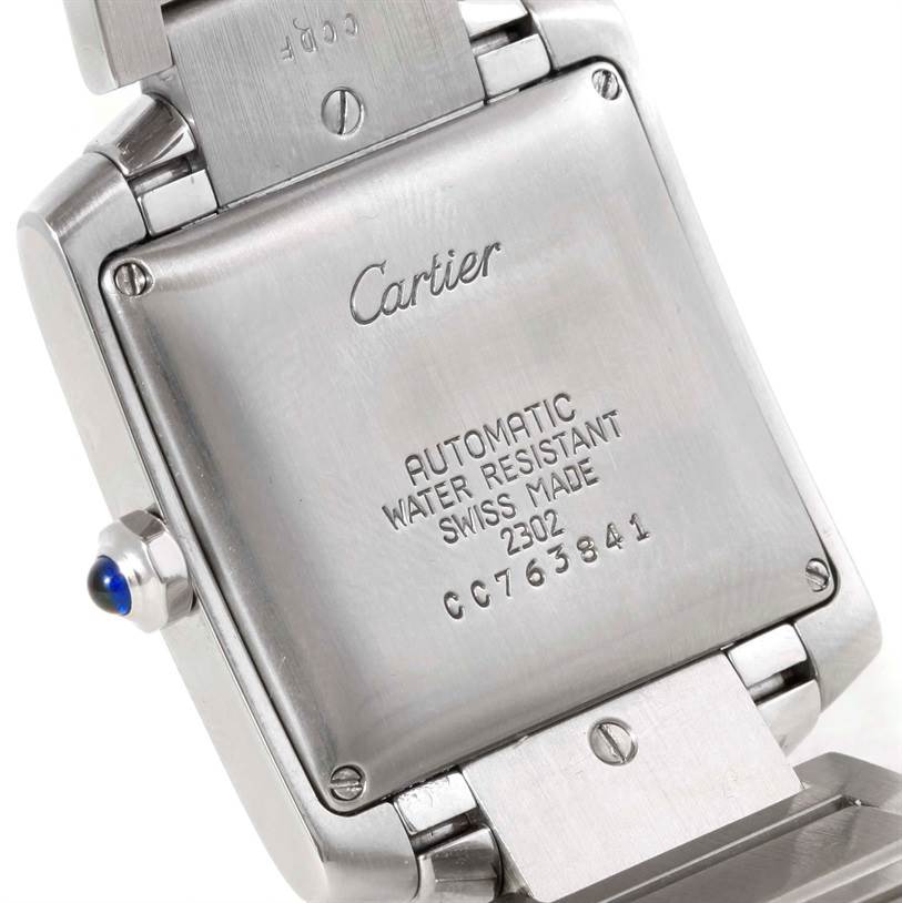 This image shows the back case and part of the bracelet of a Cartier Tank Francaise W51002Q3 Men
s Stainless Steel Silver Dial W51002Q3 Men
s Stainless Steel Silver Dial watch, highlighting its engravings.