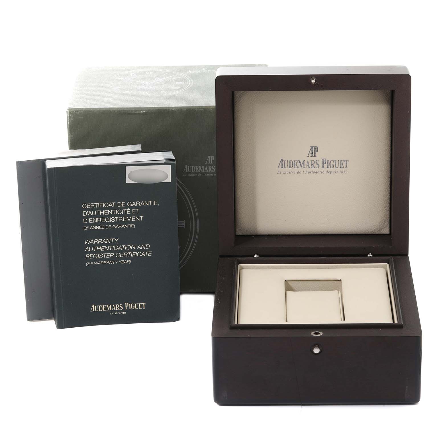 The image shows an open Audemars Piguet Millenary 77301ST Women's Stainless Steel Pink Dial 77301ST Women's Stainless Steel Pink Dial watch box with accompanying warranty booklets placed beside it.