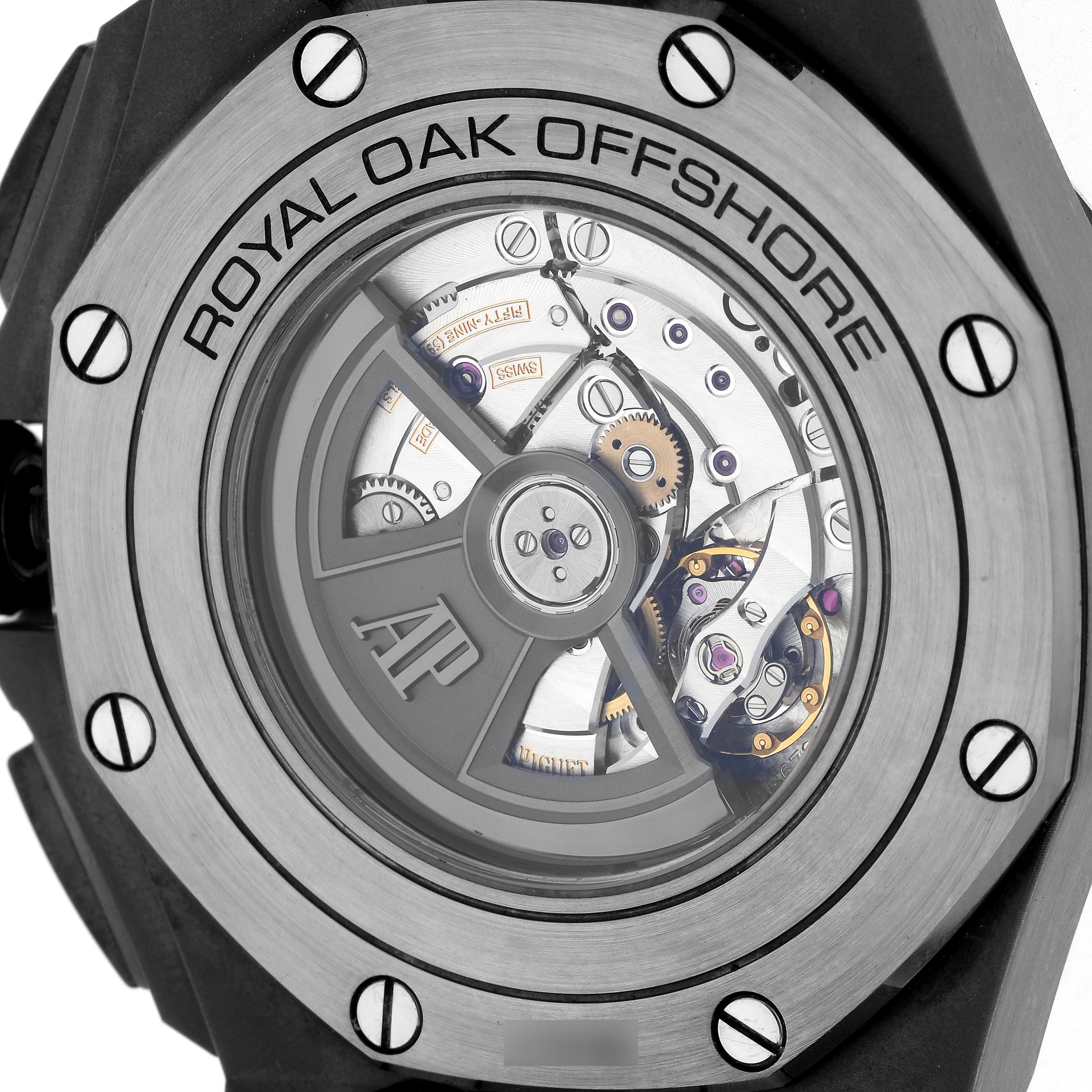 The image shows the back view of a Royal Oak Offshore by Audemars Piguet, highlighting its movement and rotor.