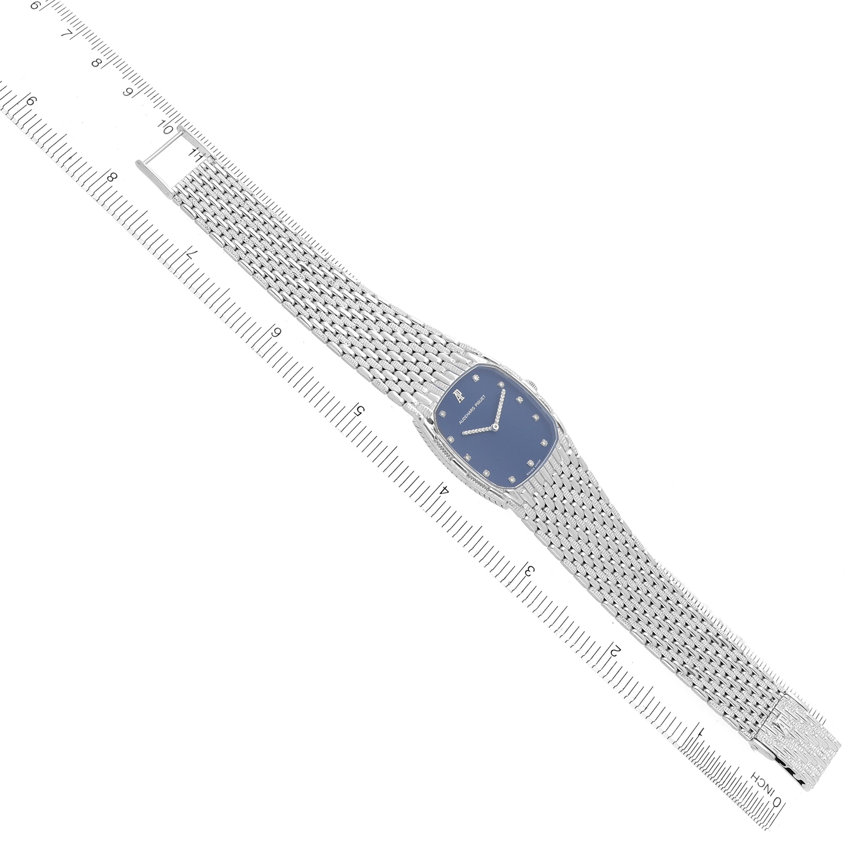 The image shows a top-down view of a vintage Audemars Piguet watch, highlighting the dial, bracelet, and clasp.