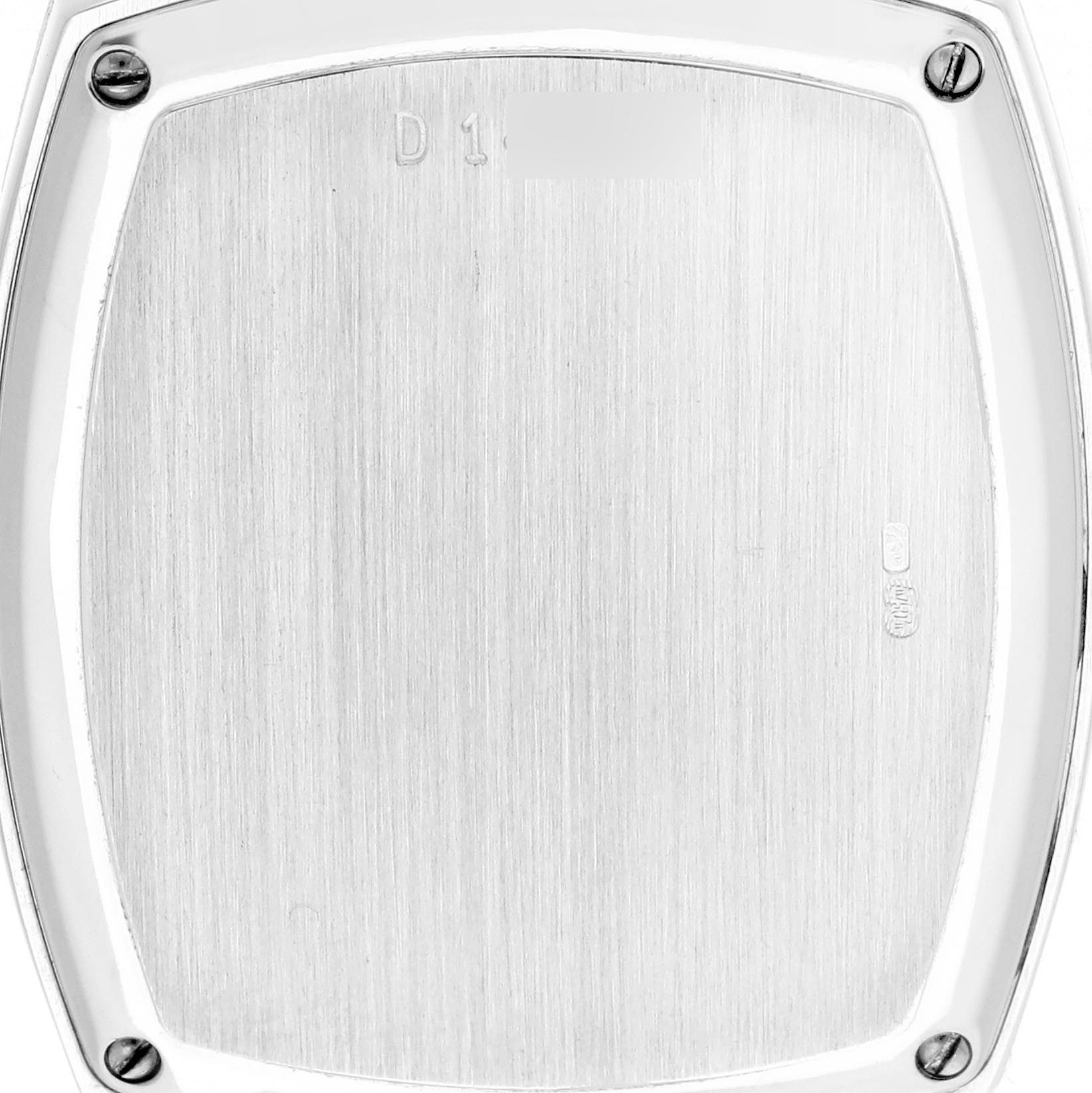 The image shows the back casing of a Vintage Audemars Piguet watch, viewed directly from the back, highlighting screws and engravings.