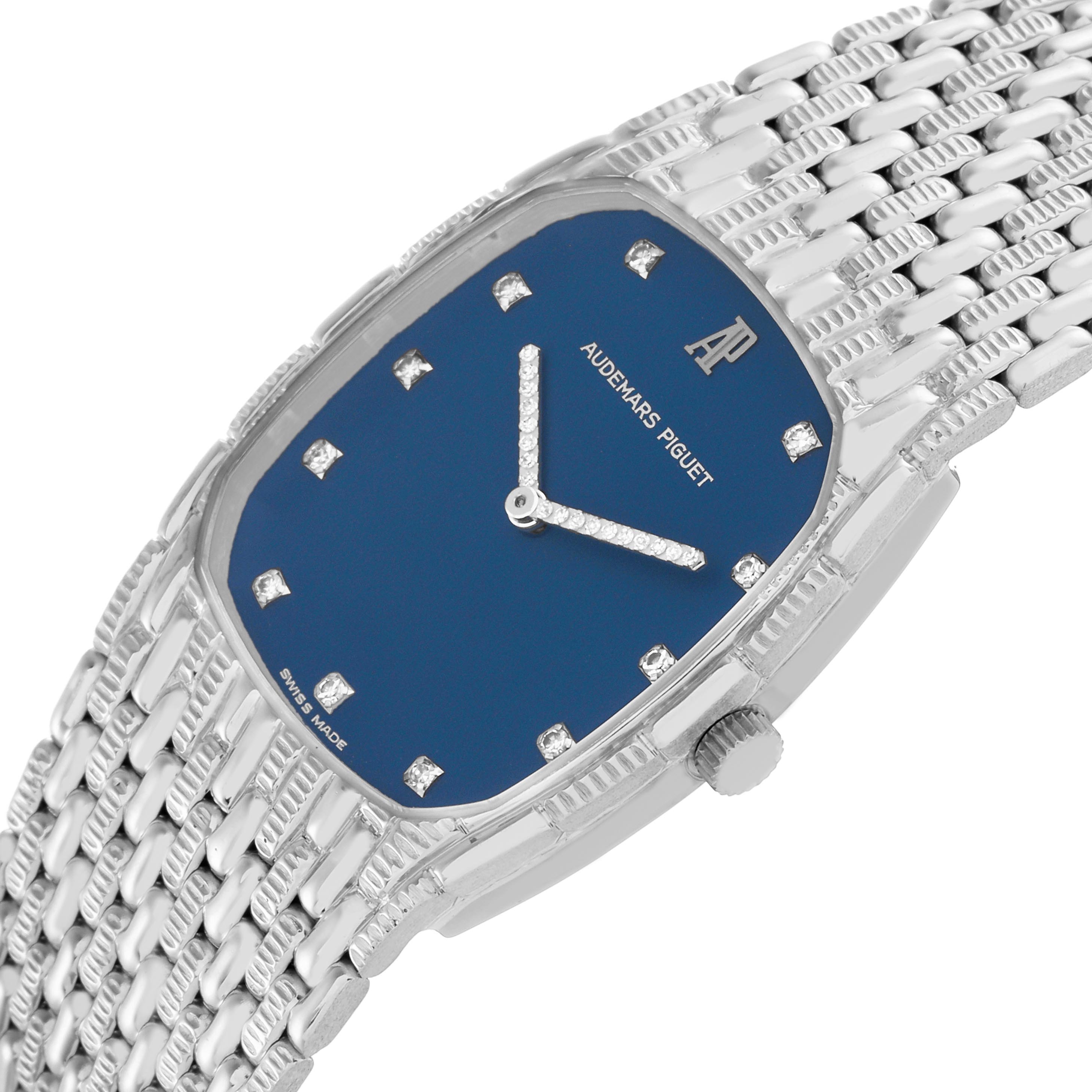 The Audemars Piguet Vintage Men's White Gold Blue Dial Men's White Gold Blue Dial watch is shown at a three-quarter angle, highlighting its blue dial, hands, crown, and woven bracelet.