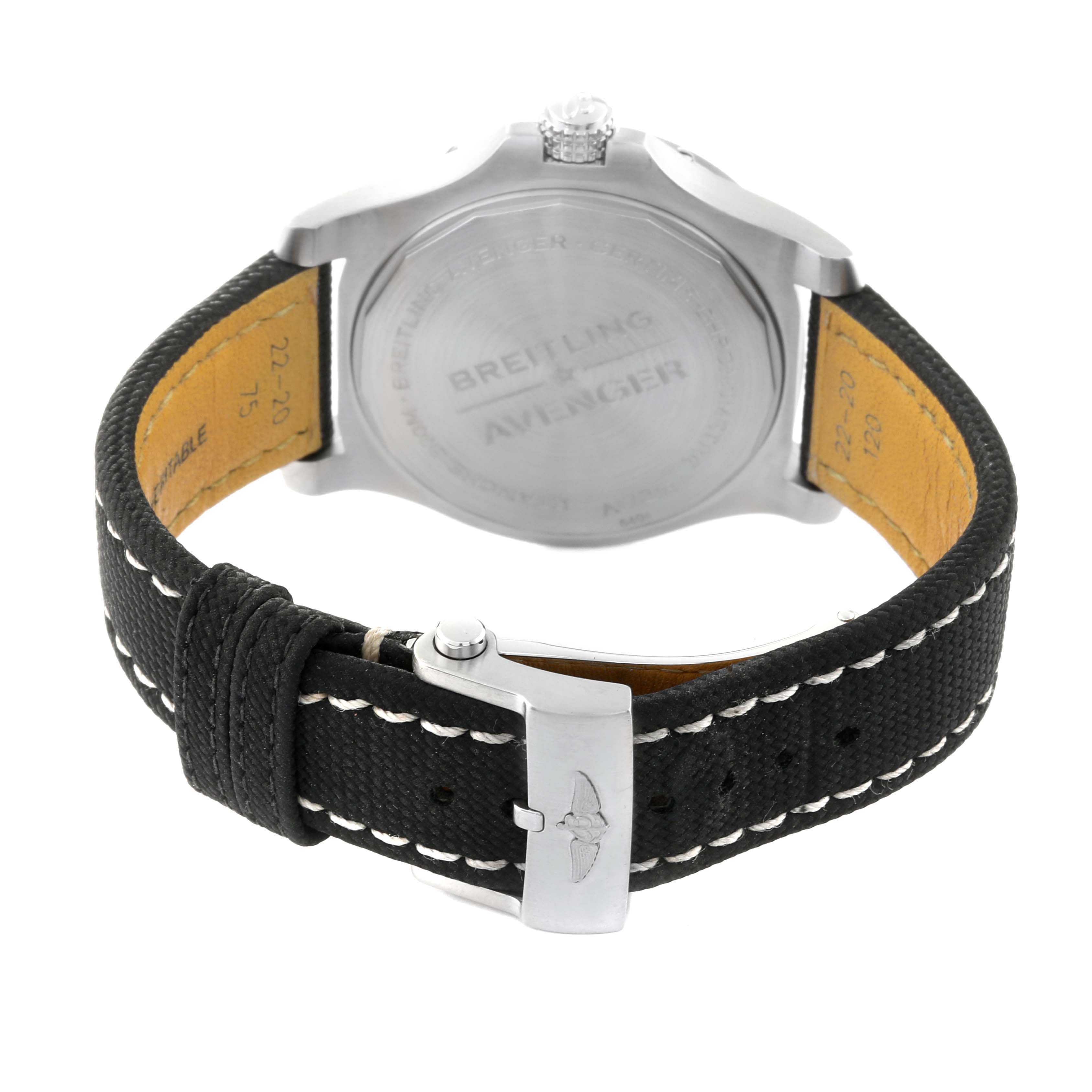 The image shows the back view of a Breitling Avenger A17318 Men's Stainless Steel Black Dial A17318 Men's Stainless Steel Black Dial watch and its black strap with white stitching.