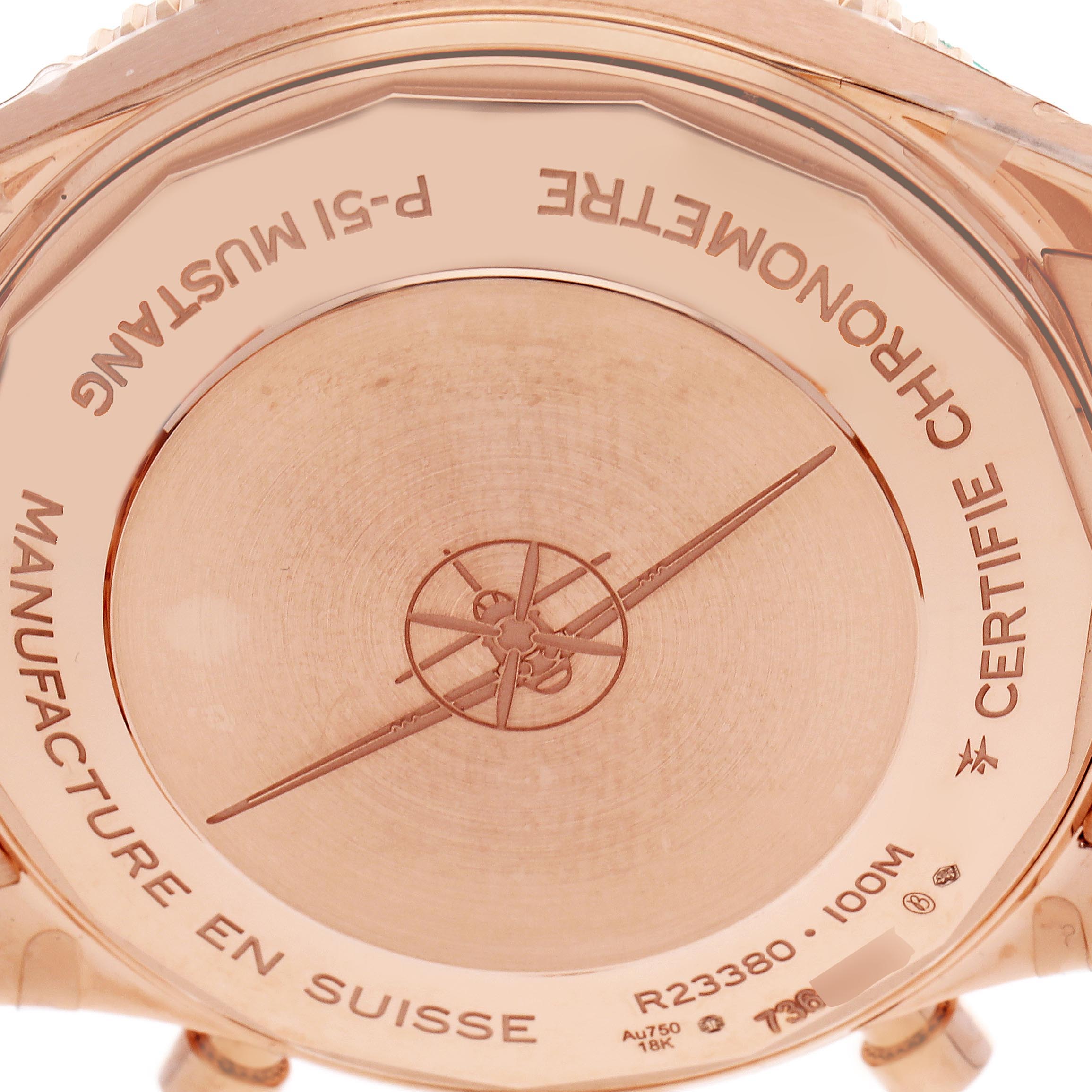 The image shows the back of an Aviator model by Breitling, highlighting its engravings and markings.