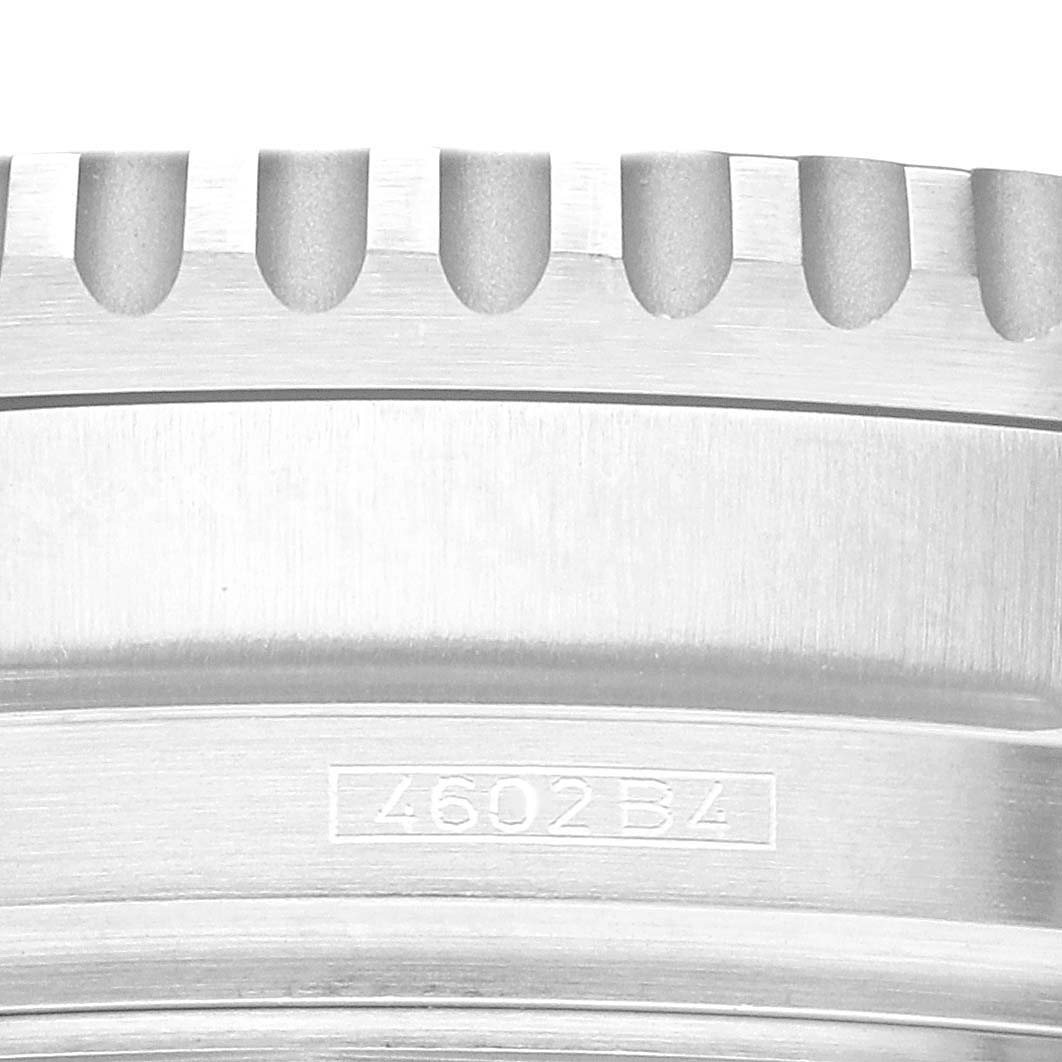 Close-up of the side of a Breitling Navitimer A41322 Men
s Stainless Steel Black Dial A41322 Men
s Stainless Steel Black Dial watch, showing the edge of the bezel and part of the case with engraved markings.