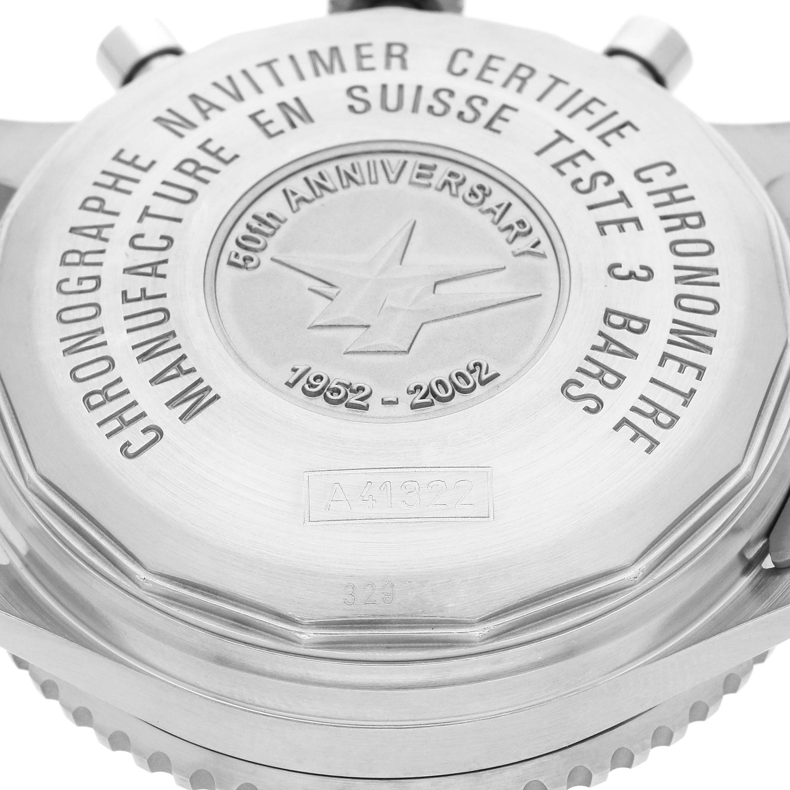 This image shows the back case of a Breitling Navitimer A41322 Men
s Stainless Steel Black Dial A41322 Men
s Stainless Steel Black Dial watch, highlighting the engraved text and 50th-anniversary logo.
