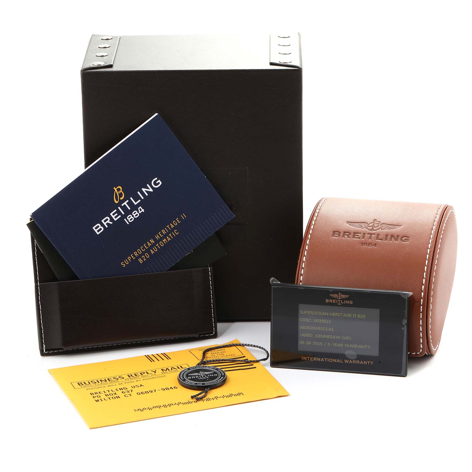 This image features the packaging and accessories for the Breitling Superocean AB202016-C961-152A Men
s Stainless Steel Blue Dial AB202016-C961-152A Men
s Stainless Steel Blue Dial model, including a box, warranty card, booklet, and leather case.