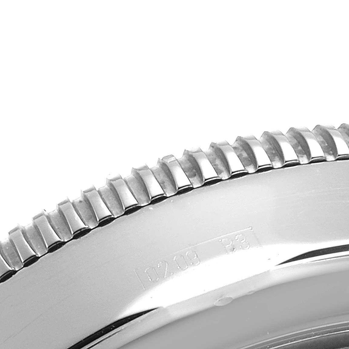 The image shows a close-up of the bezel and part of the case of a Breitling Superocean A13320 Men's Stainless Steel Silver Dial A13320 Men's Stainless Steel Silver Dial watch.