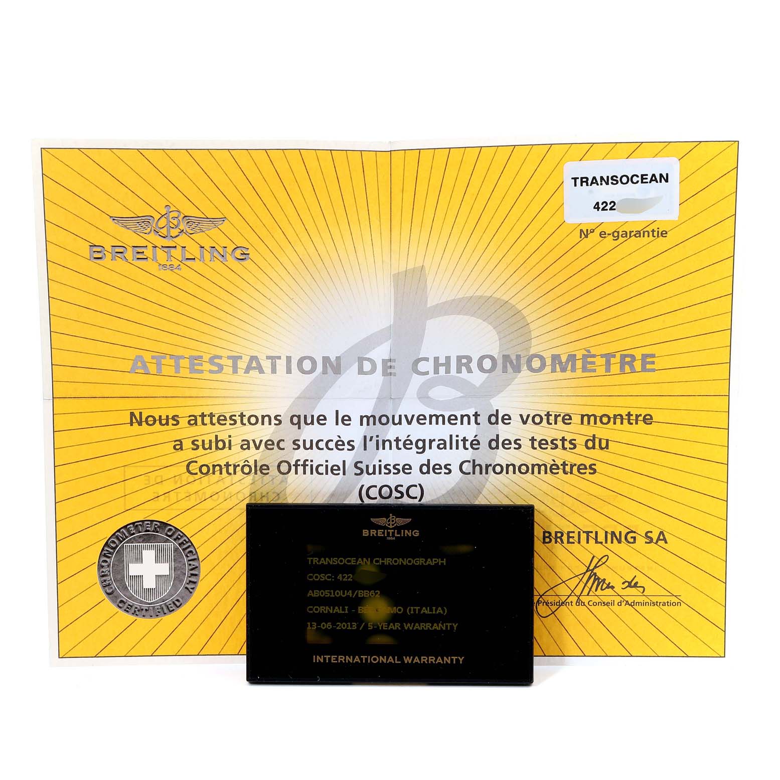 The image shows the Breitling Transocean AB0510 Men's Stainless Steel Black Dial AB0510 Men's Stainless Steel Black Dial model's certificate of chronometer and international warranty card.