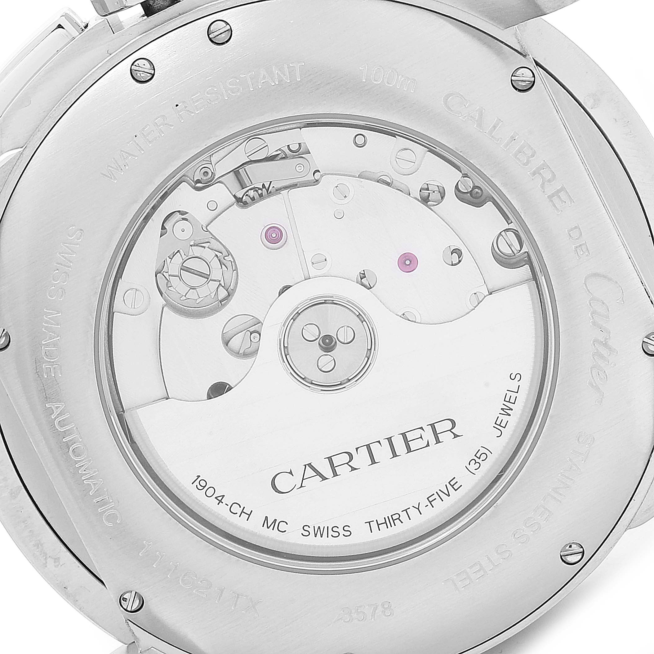The image shows the back of the Calibre de Cartier watch by Cartier, highlighting the automatic movement and detailed engravings.