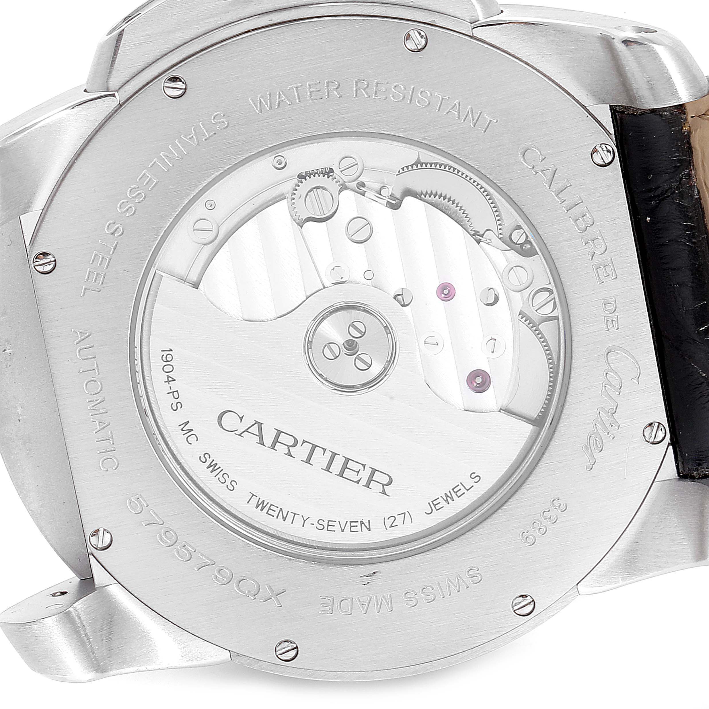 This image shows the back case of the Calibre de Cartier watch by Cartier, highlighting its automatic movement and internal mechanism.