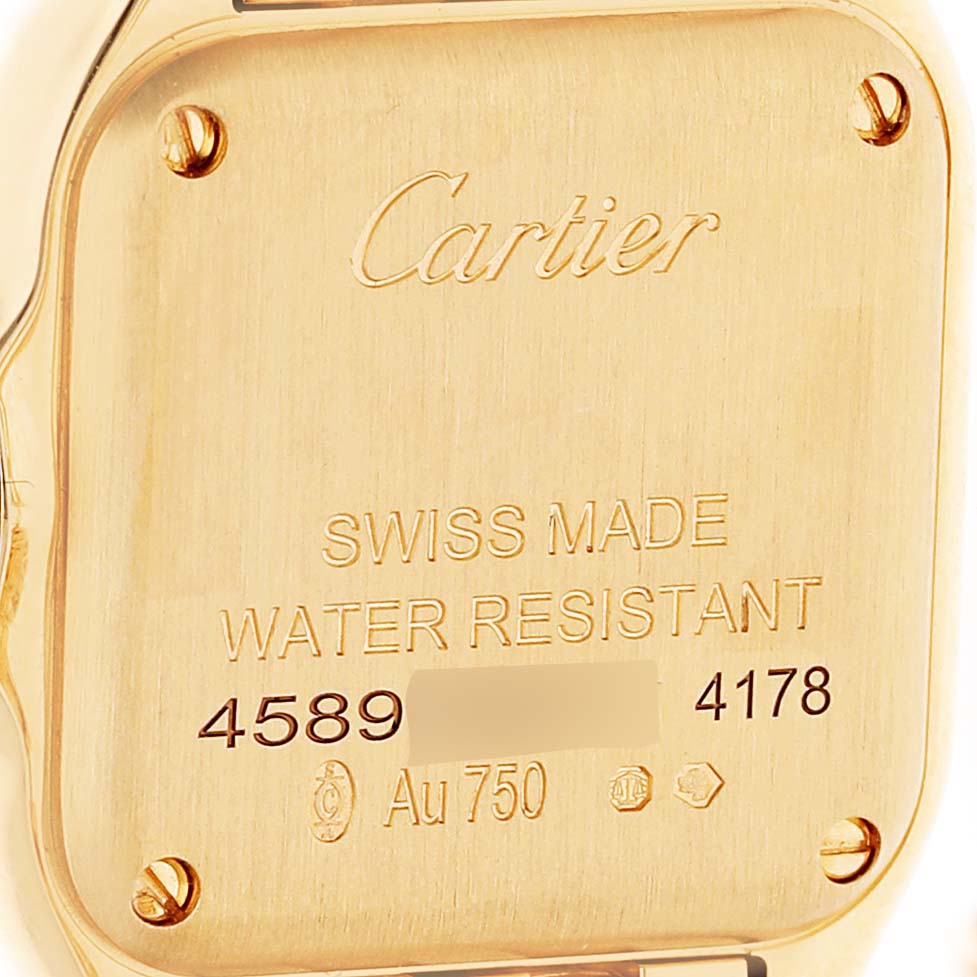 The image shows the back case of the Cartier Panthere WJPN0057 Women's Yellow Gold Yellow Dial watch, featuring engravings and screws.