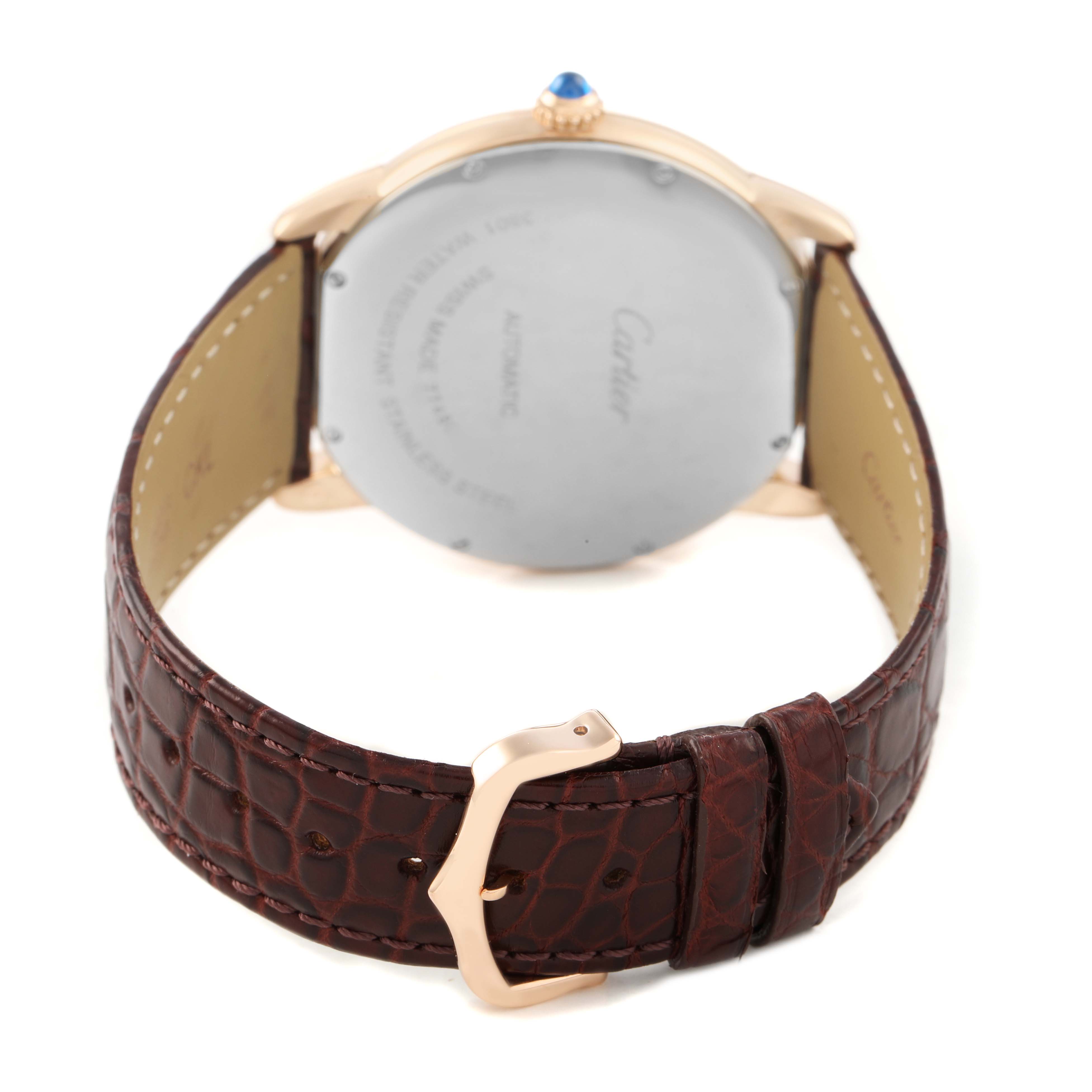The Cartier Ronde W6701009 Men's Steel and Gold (two tone) Silver Dial watch is shown from the back, highlighting its case back, leather strap, and buckle.