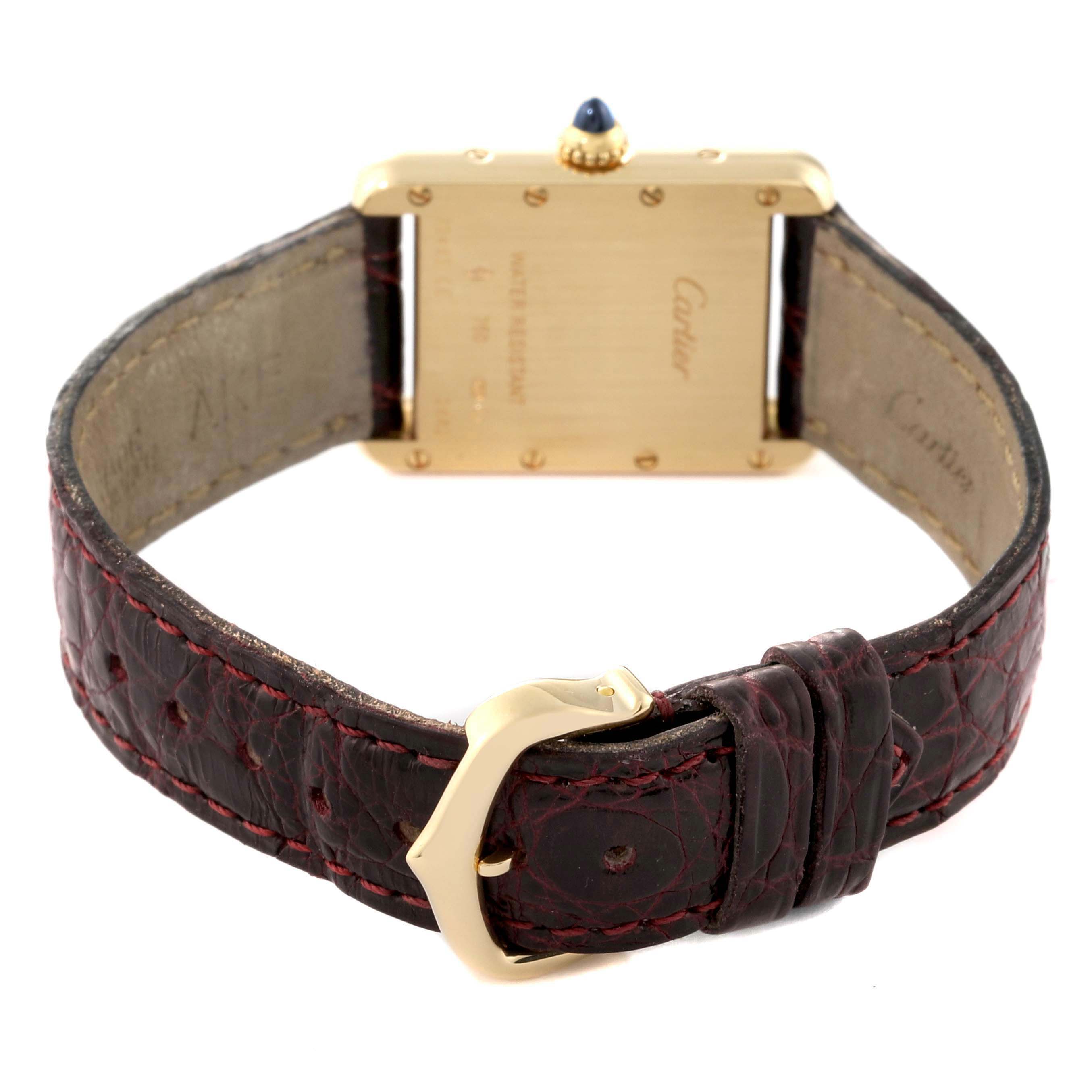 This image shows the back and strap of the Cartier Tank Louis W1529856 Women's Yellow Gold Silver Dial W1529856 Women's Yellow Gold Silver Dial watch, highlighting the case back and gold buckle.