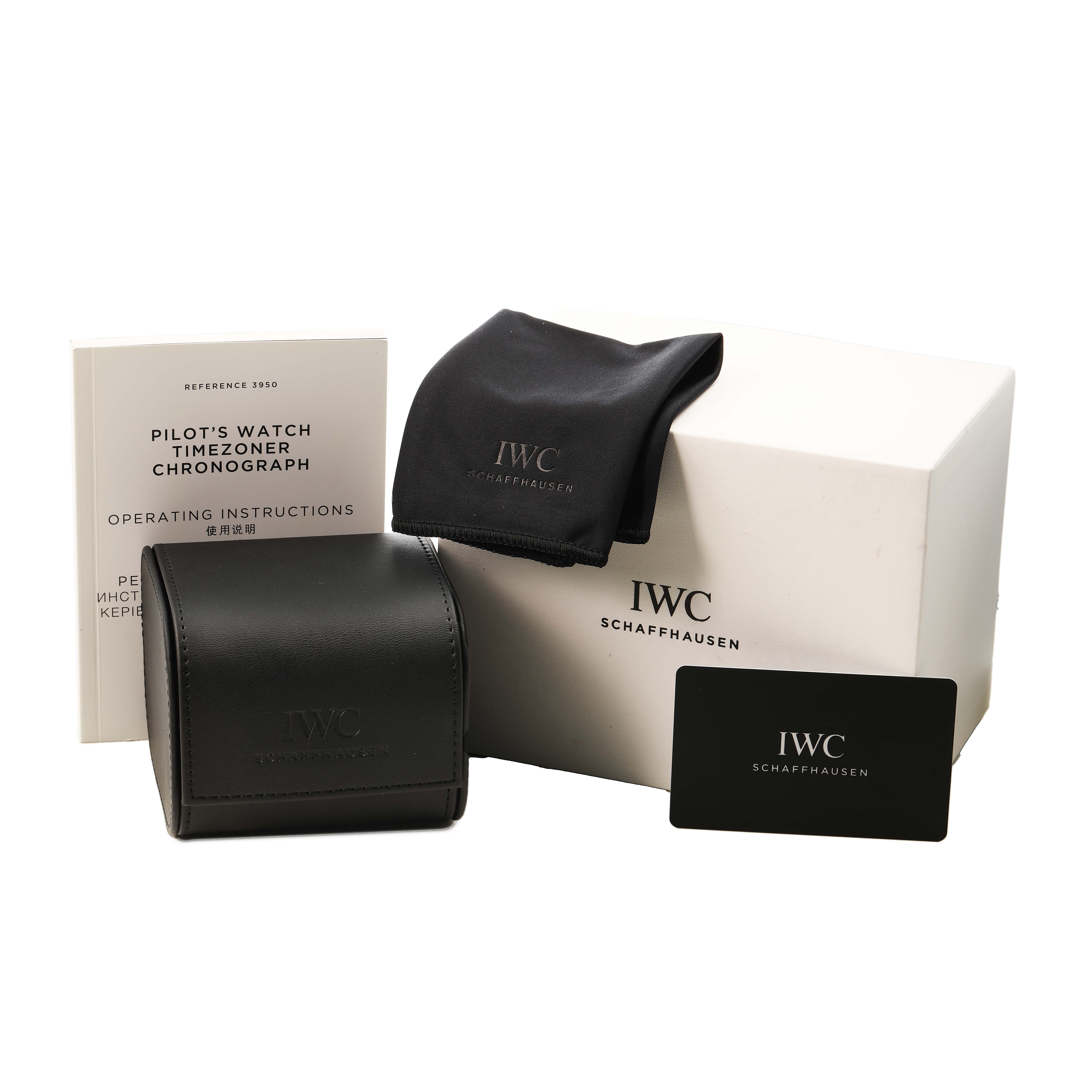 The image shows IWC Pilot IW395001 Men's Stainless Steel Black Dial's Watch accessories, including a box, instruction booklet, cloth, and card, viewed from the front.