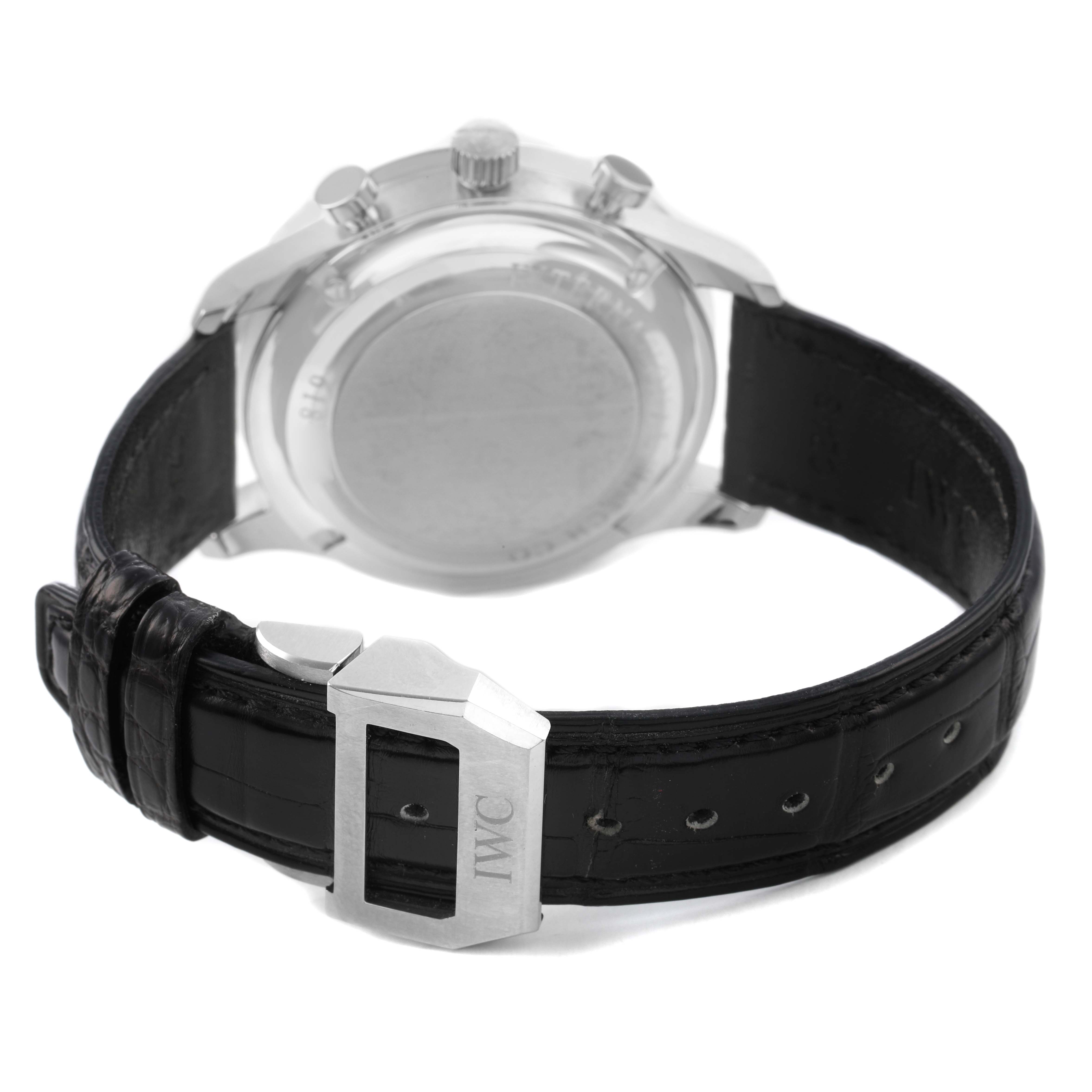 The image shows the backside of the IWC Portuguese IW371491 Men's Stainless Steel Blue Dial watch, highlighting the case back, black strap, and buckle with "IWC" inscribed.