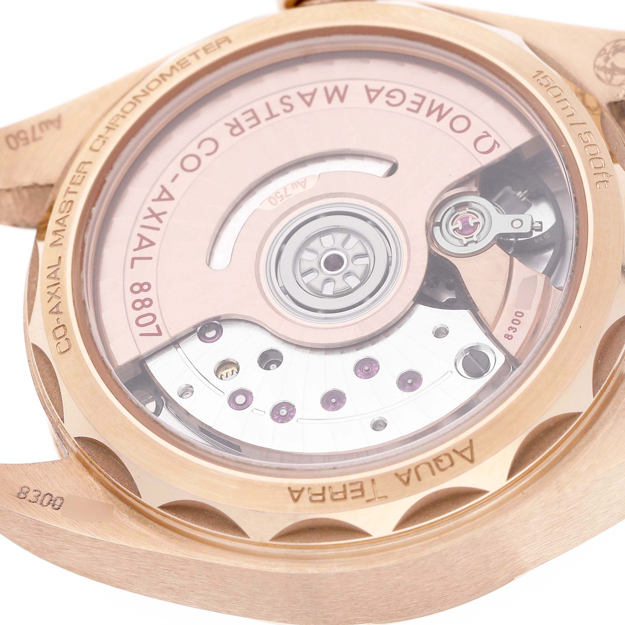 The image shows the back view of the Omega 220.55.34.20.99.001 Women's Rose Gold Silver Dial Aqua Terra 34 Rose Gold Diamond Ruby Ladies 220.55.34.20.99.001, highlighting the inner mechanism.