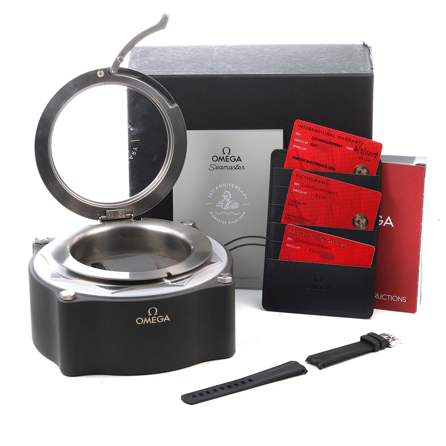 The image shows the Omega Seamaster 210.60.42.20.99.001 Men's Titanium Grey Dial packaging with open box, warranty cards, booklets, and additional straps.