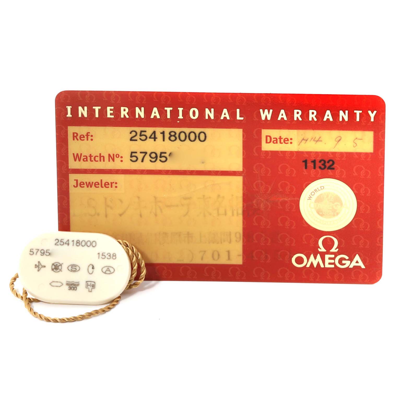 This image shows an Omega Seamaster 2541.80.00 Men's Stainless Steel Blue Dial 2541.80.00 Men's Stainless Steel Blue Dial model's warranty card and a hang tag with reference and watch numbers.