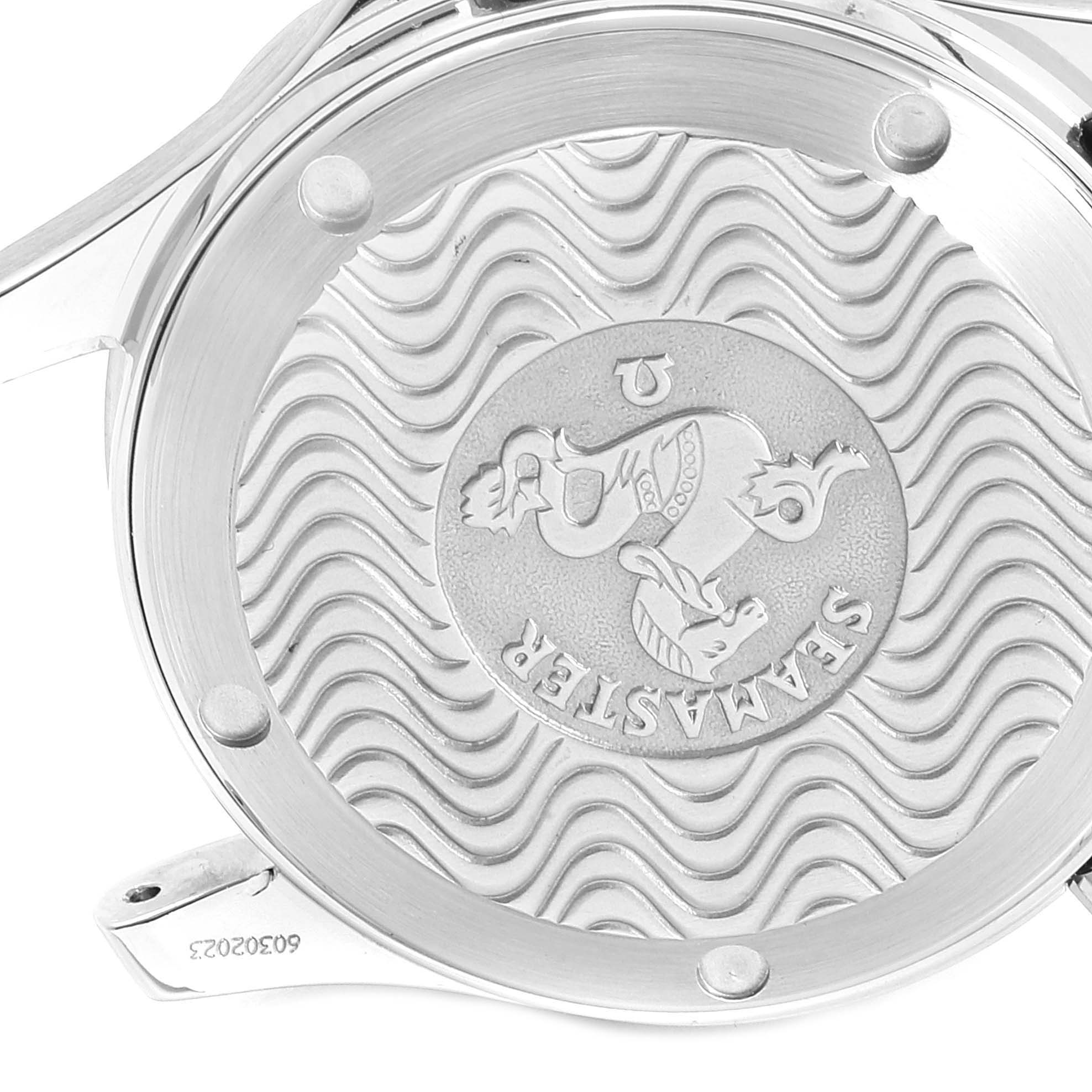 This image shows the back casing of an Omega Speedmaster 2551.80.00 Men
s Stainless Steel Blue Dial 2551.80.00 Men
s Stainless Steel Blue Dial watch, featuring an engraved emblem and the model number.