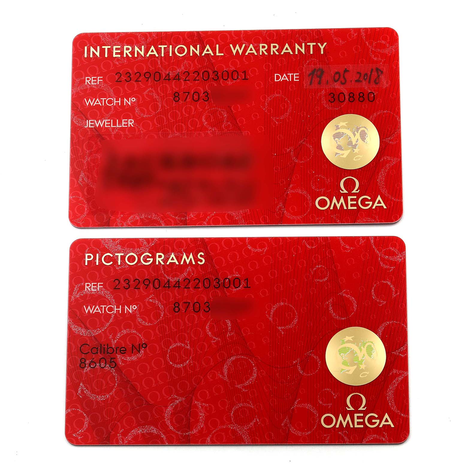The image shows international warranty and pictograms cards for an Omega Planet Ocean 232.90.44.22.03.001 Men's Titanium Blue Dial 232.90.44.22.03.001 Men's Titanium Blue Dial model watch.