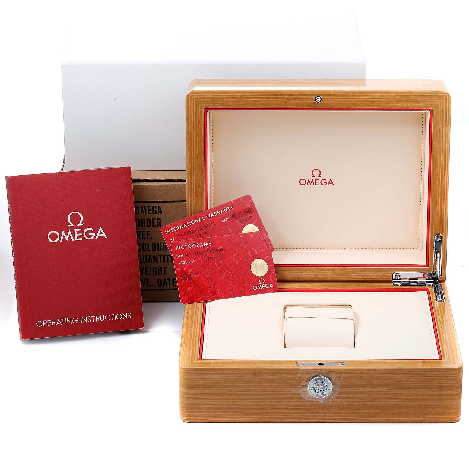 The image shows the packaging and accessories for the Omega Planet Ocean 232.90.44.22.03.001 Men's Titanium Blue Dial 232.90.44.22.03.001 Men's Titanium Blue Dial model, including the box, warranty cards, and instruction booklet.