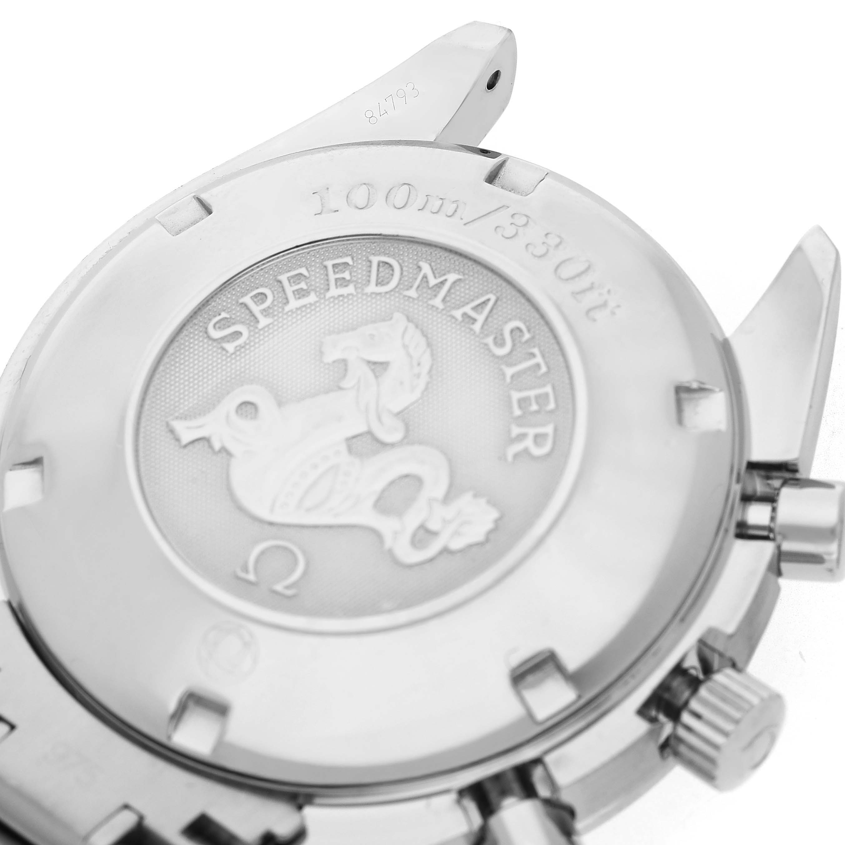 The image shows the back case of an Omega Speedmaster 3210.50.00 Men's Stainless Steel Black Dial watch, featuring the emblem and information about water resistance.