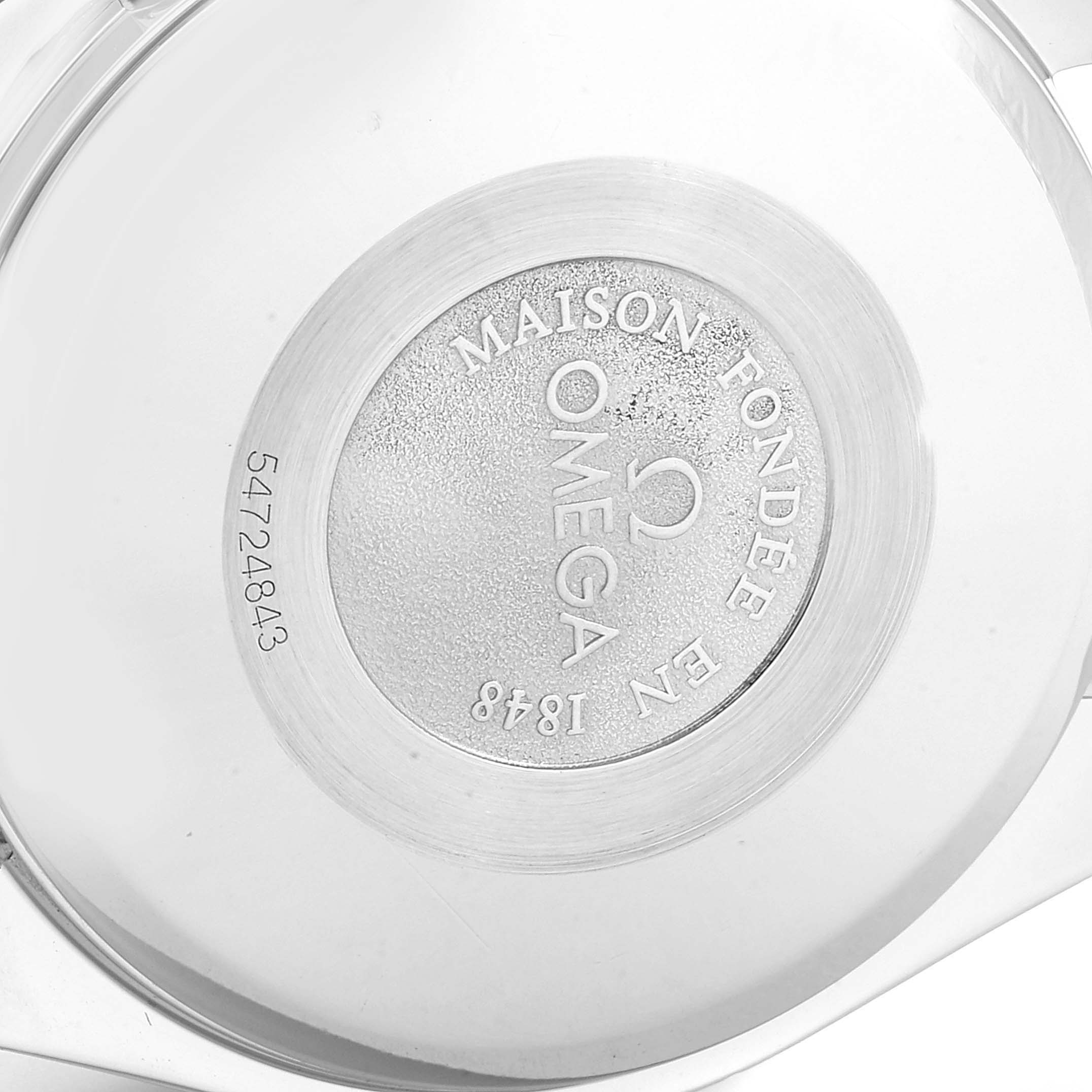 This image shows the case back of the Omega Speedmaster 3521.30.00 Men's Stainless Steel Silver Dial 3521.30.00 Men's Stainless Steel Silver Dial watch, detailing the brand's logo and model information.