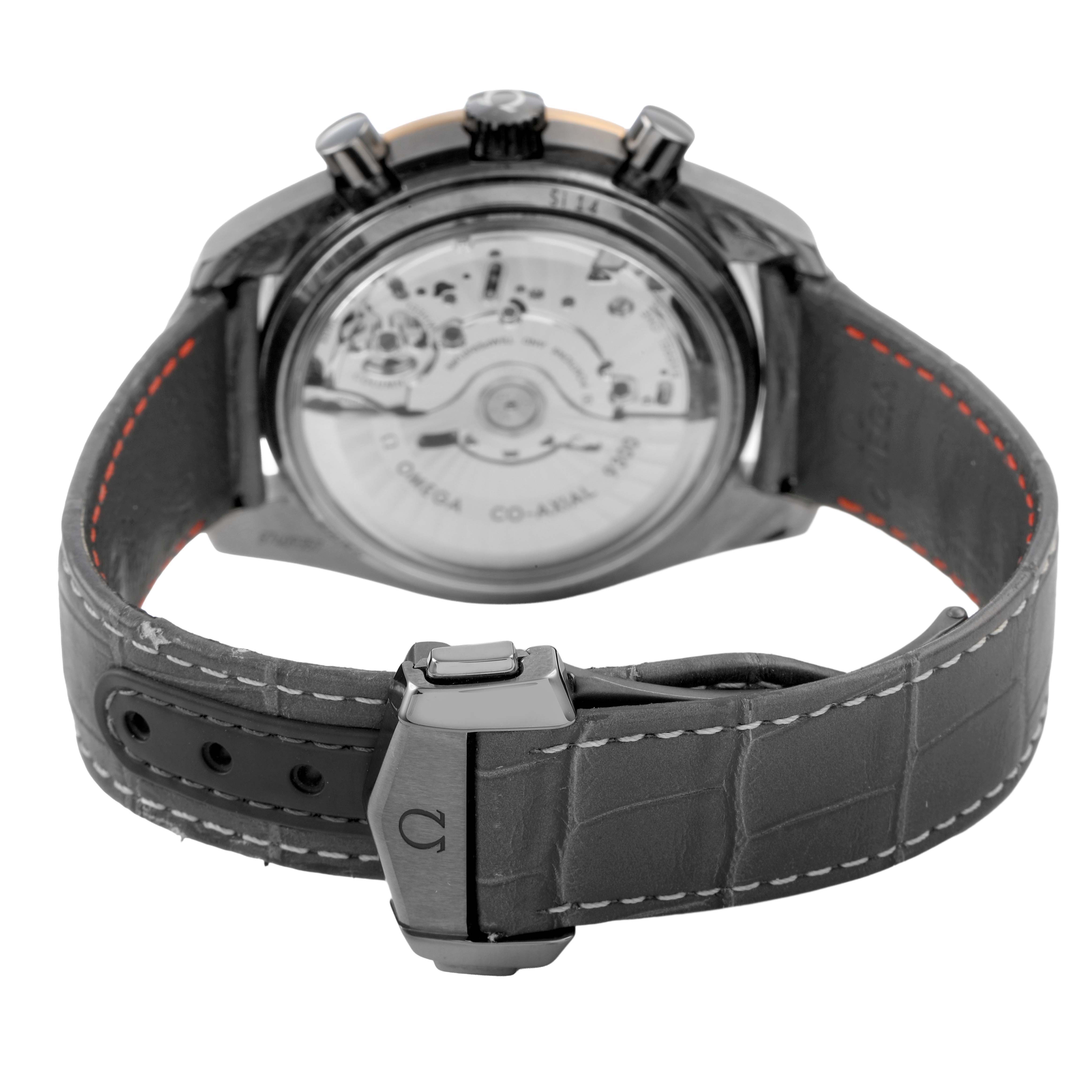 The image shows the back view of the Omega Speedmaster 311.63.44.51.99.001 Men's Ceramic Grey Dial, highlighting its transparent case back and leather strap with clasp.