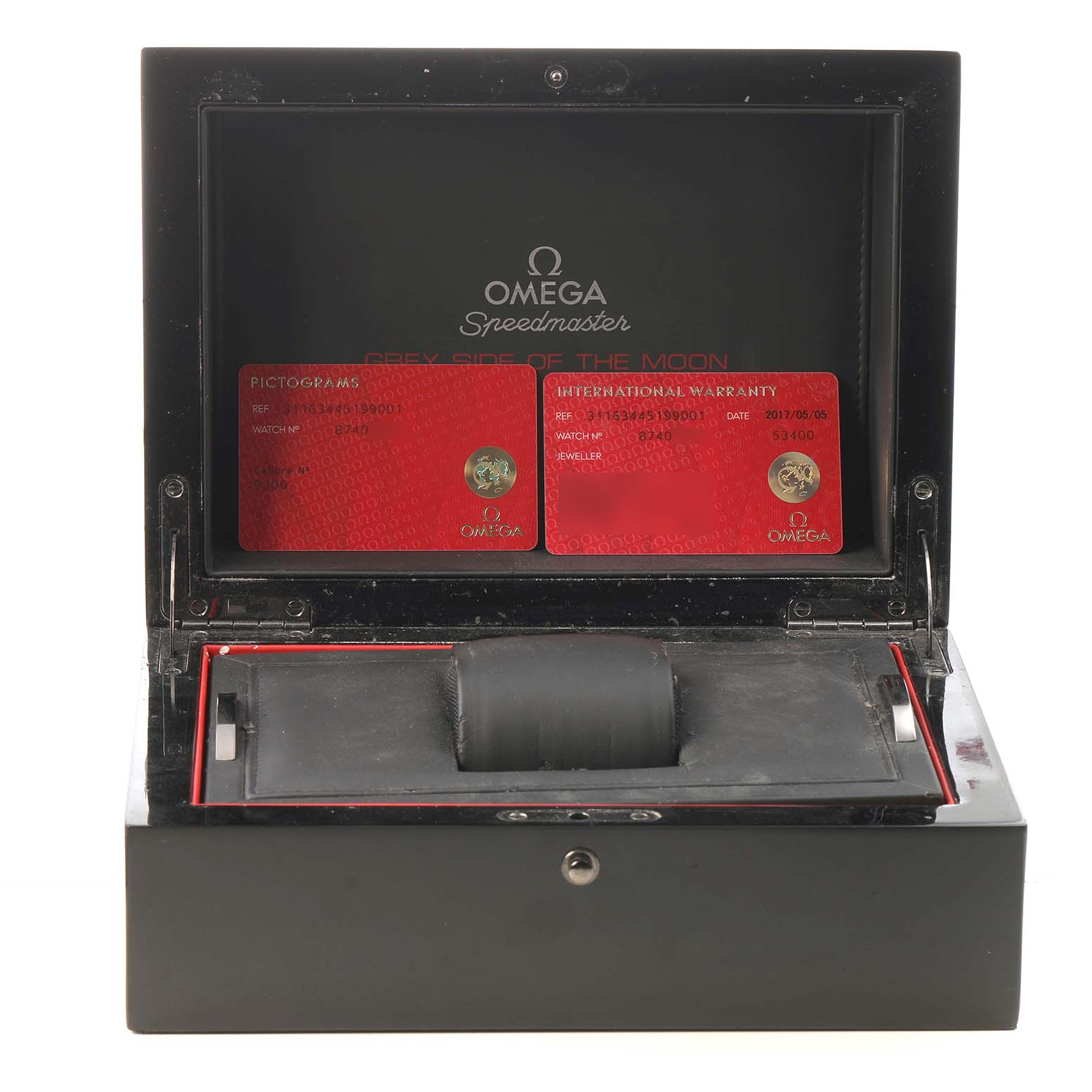 The image shows an open Omega Speedmaster 311.63.44.51.99.001 Men's Ceramic Grey Dial watch box with warranty cards inside.