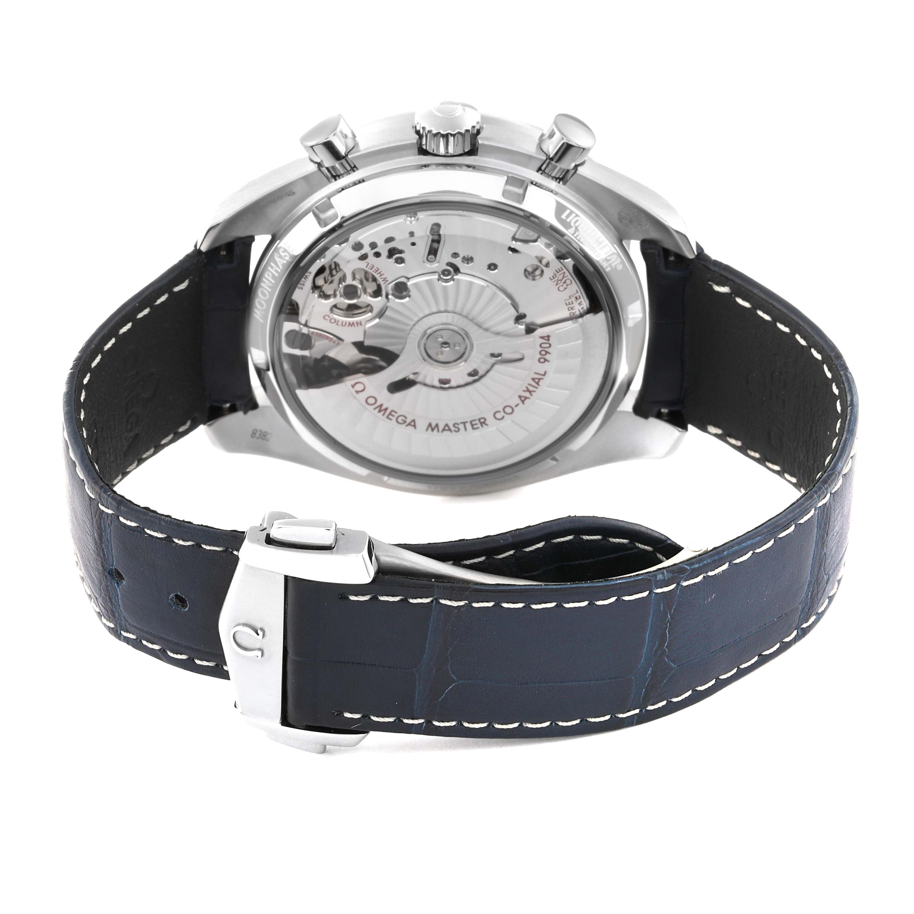 The image shows the back view of an Omega Speedmaster 304.33.44.52.03.001 Men
s Stainless Steel Blue Dial 304.33.44.52.03.001 Men
s Stainless Steel Blue Dial watch displaying its exposed movement and leather strap with buckle.