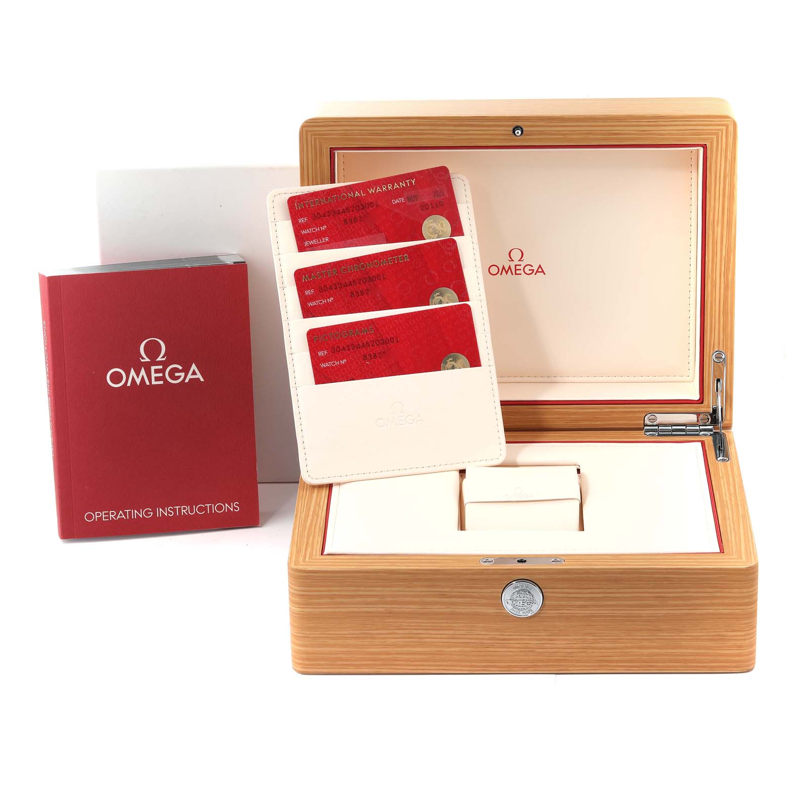 The image shows an Omega Speedmaster 304.33.44.52.03.001 Men
s Stainless Steel Blue Dial 304.33.44.52.03.001 Men
s Stainless Steel Blue Dial watch box with operating instructions and warranty cards at an open angle.